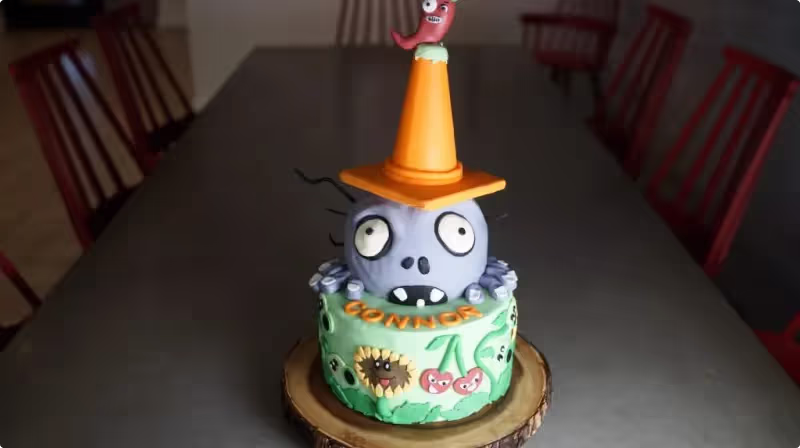 Decorated zombie-themed cake made by the author during her cake decorating classes